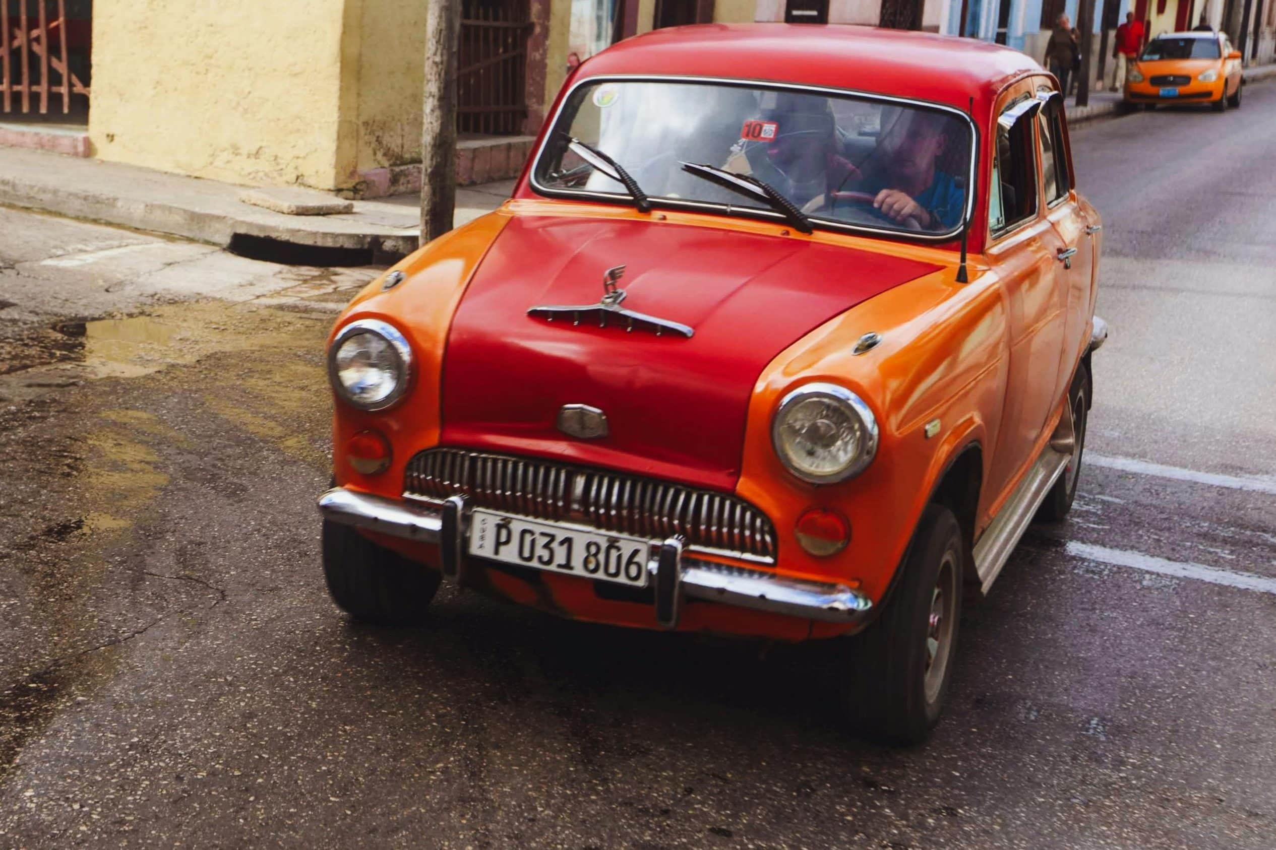 Small car passing the wet road